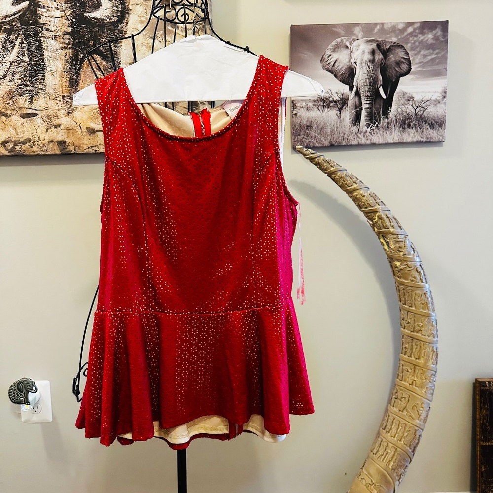 Faux leather sleeve-less top. Couture Peplum top